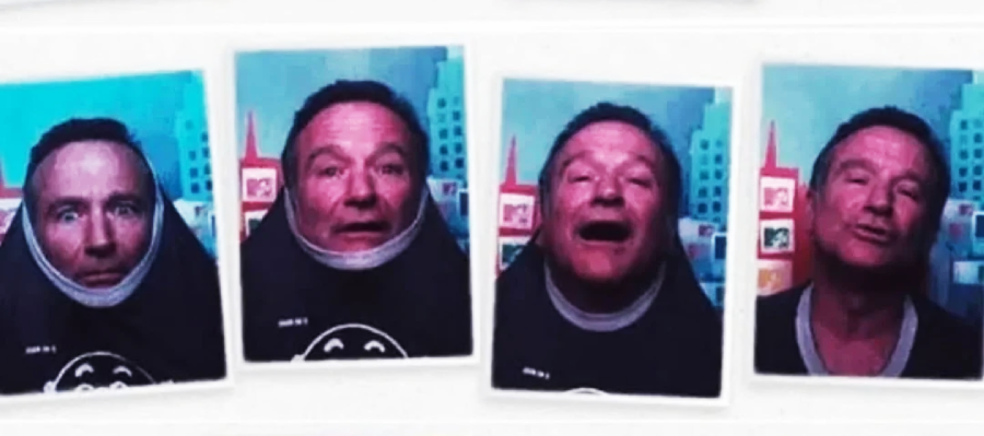 Four photo booth images of a man making different funny faces; in the first two, he has his t-shirt pulled over his head, while in the last two he is smiling and posing normally against a colorful backdrop.