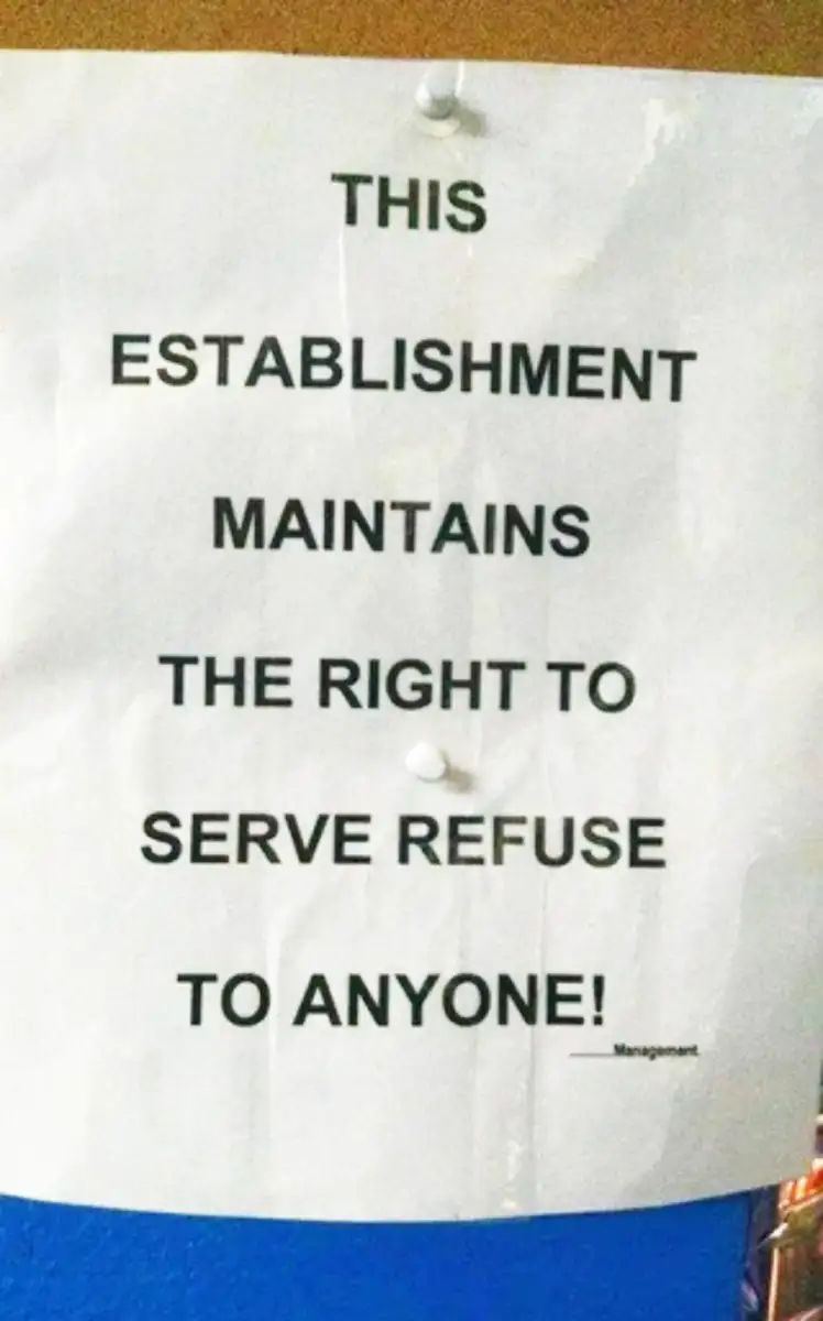 A printed sign reads: "THIS ESTABLISHMENT MAINTAINS THE RIGHT TO SERVE REFUSE TO ANYONE! —Management." The word order is incorrect. The sign is pinned to a board.