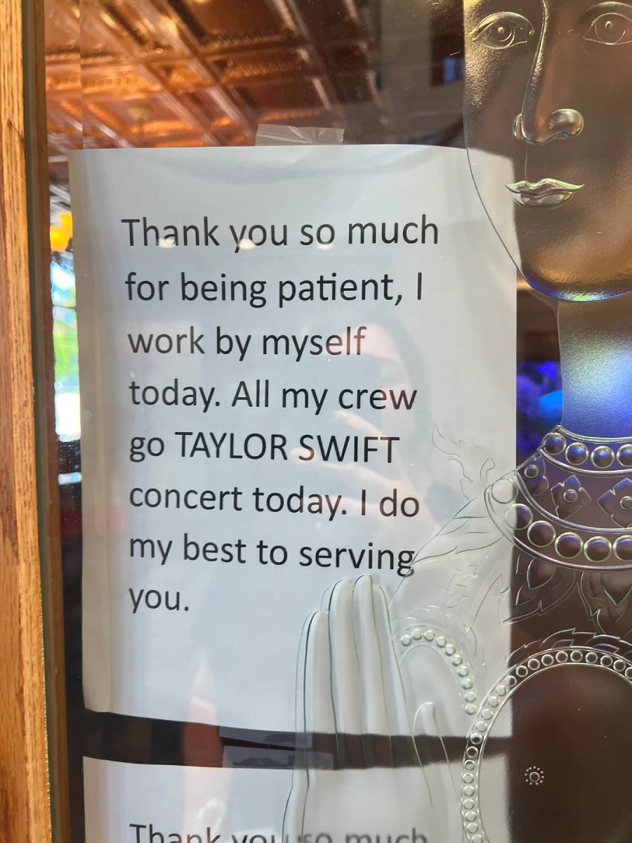 A sign on a door reads: "Thank you so much for being patient, I work by myself today. All my crew go TAYLOR SWIFT concert today. I do my best to serving you." A partial image of an ornate drawing is visible.
