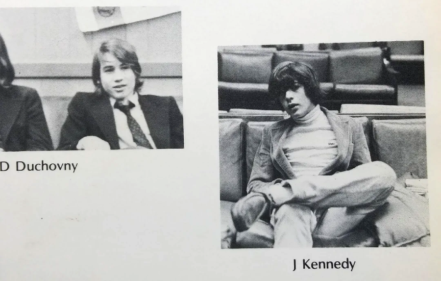 Two black-and-white yearbook photos: on the left, a young man in a suit and tie; on the right, another young man in a turtleneck and blazer sitting with his legs crossed. The labels read "D Duchovny" and "J Kennedy.