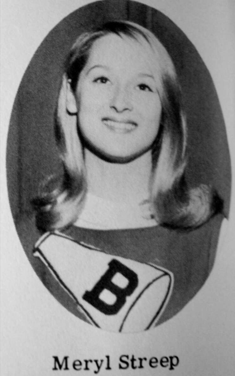 A black-and-white yearbook photo of a young woman with long, light hair, smiling. She is wearing a sweater with a large letter "B" on it. The text below the photo reads "Meryl Streep.