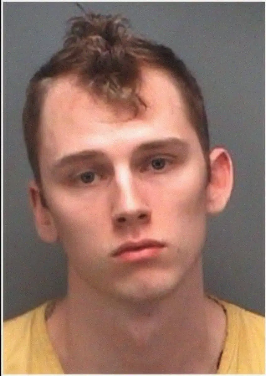 A man in a yellow shirt