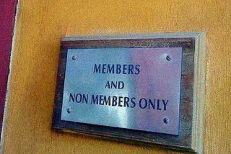 A metal sign on a wall reads "MEMBERS AND NON MEMBERS ONLY," making the restriction unclear and seemingly allowing everyone access.