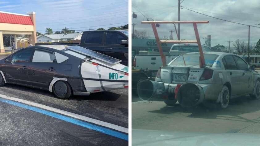 Two modified cars: the left is a dark Prius with white rear panels, solar panels, and a fin; the right is a silver sedan with large rear pipes, a red wing, and various attachments on the back.