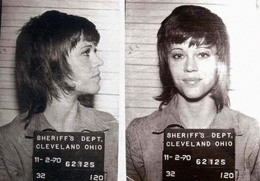 Black and white mugshot of a young woman with short hair, shown in profile and facing forward, holding a sign that reads "Sheriff's Dept. Cleveland Ohio 11-2-70 62125.