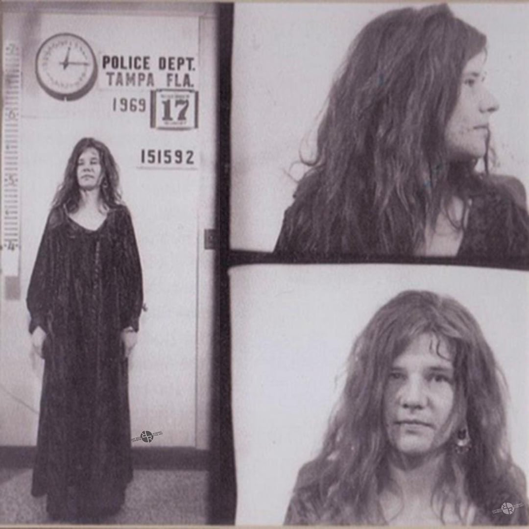 Black and white mugshots of a woman with long, wavy hair wearing a long dark dress, taken at the Tampa Police Department in 1969. The wall clock and booking details are visible in the photos.