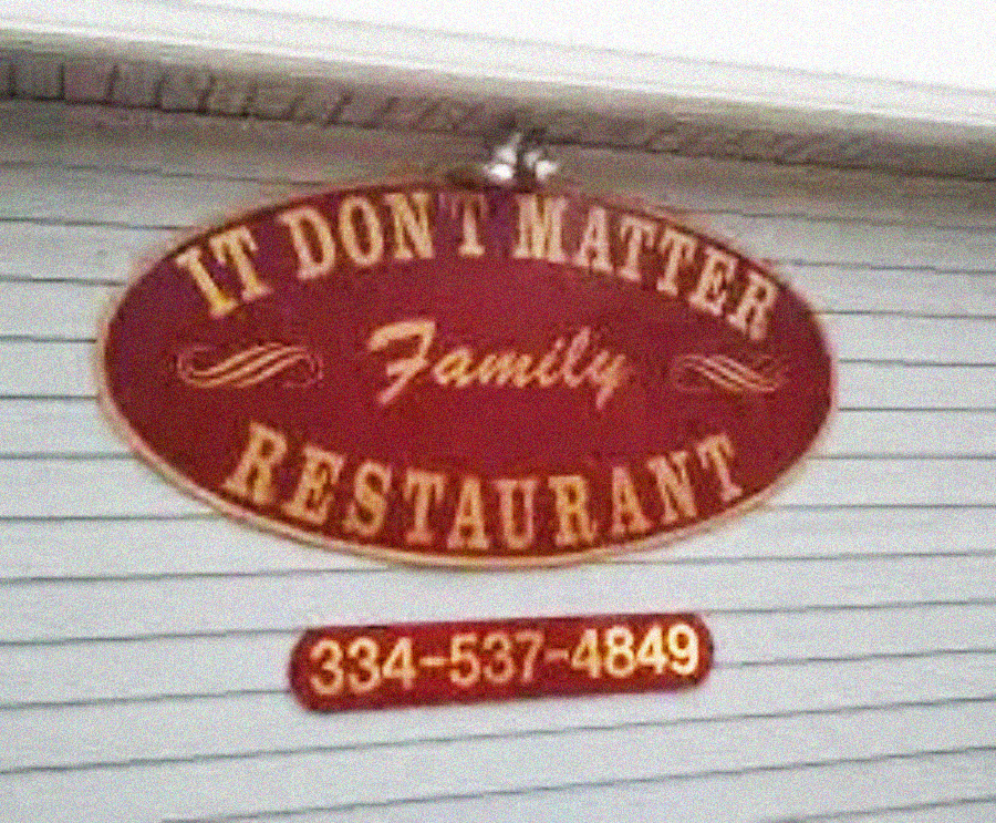 A red oval sign on a white building reads "It Don't Matter Family Restaurant" in yellow letters, with a phone number "334-537-4849" displayed below.