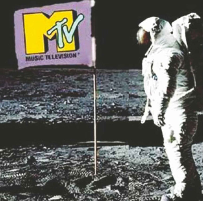An astronaut in a spacesuit stands on the moon next to a flagpole, but instead of a national flag, the flag displays the MTV Music Television logo.