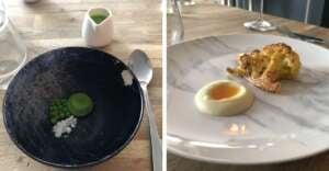 Two plates of minimalist gourmet food: one with a few green peas, a green sauce disk, and a white powder on a black plate; the other with roasted cauliflower and a dollop of creamy sauce with a yellow center on a white plate.