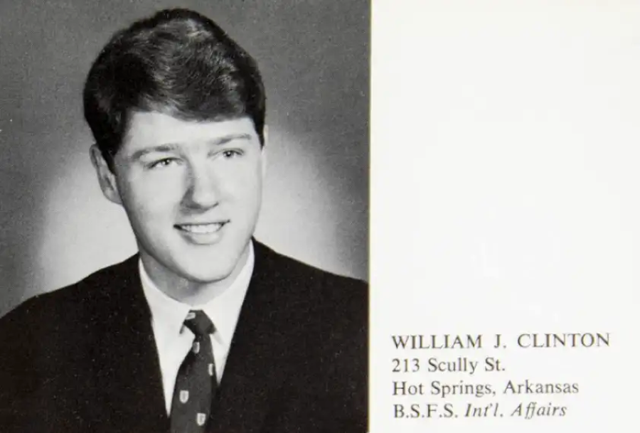 Black and white yearbook photo of a young man in a suit and tie, smiling slightly. Text beside the photo reads: "William J. Clinton, 213 Scully St., Hot Springs, Arkansas, B.S.F.S. Int’l. Affairs.