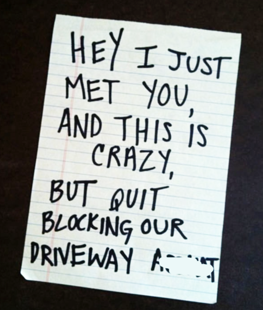 A handwritten note on lined paper reads: "Hey I just met you, and this is crazy, but quit blocking our driveway" with a partially obscured word at the end.