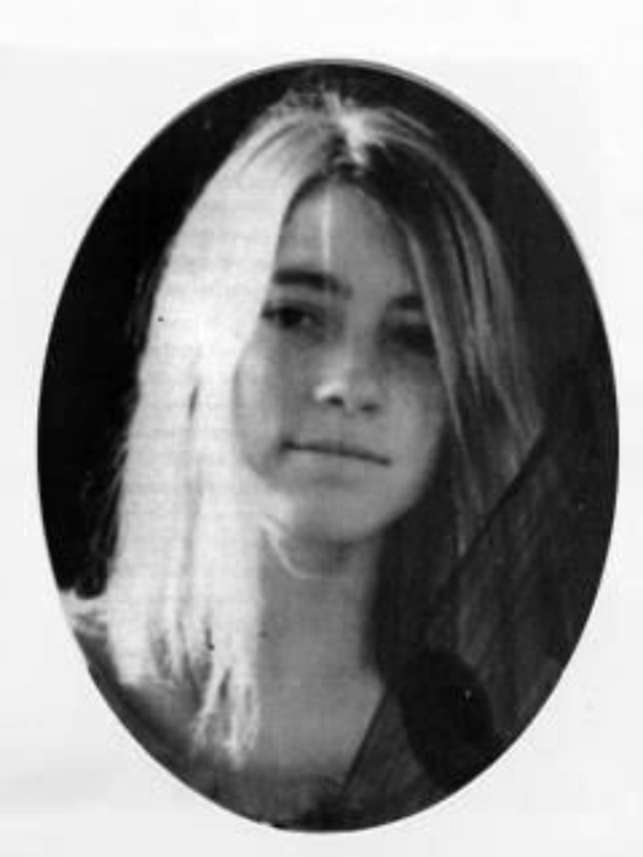 Black and white portrait of a young woman with long, straight hair, looking at the camera with a neutral expression. The image is framed in an oval shape.