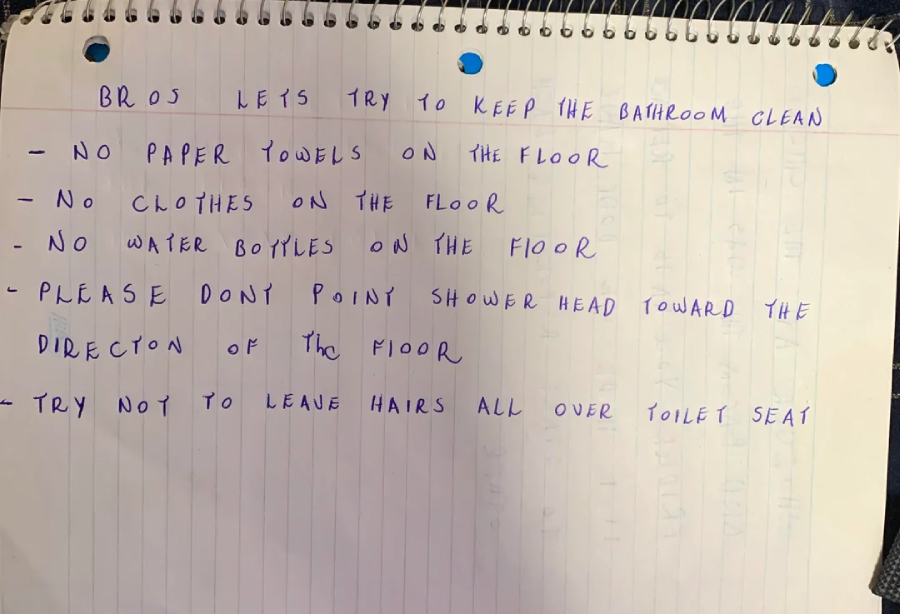 A handwritten list on lined paper gives bathroom rules: keep clean, no paper towels, clothes, or water bottles on the floor, don’t point the showerhead at the floor, and avoid leaving hairs on the toilet seat.