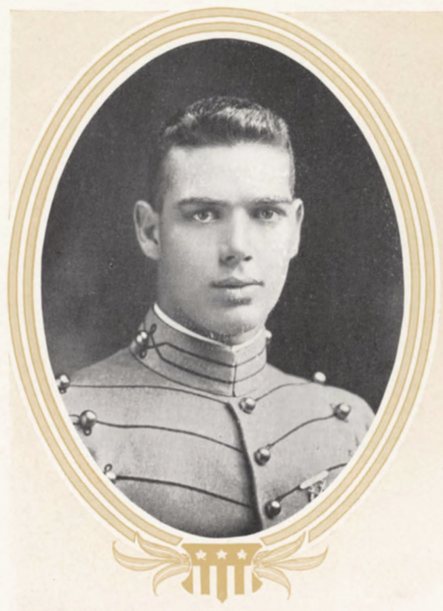 Black and white portrait of a young man in a formal military uniform with decorative buttons, facing forward, framed by an oval border with a decorative emblem at the bottom.