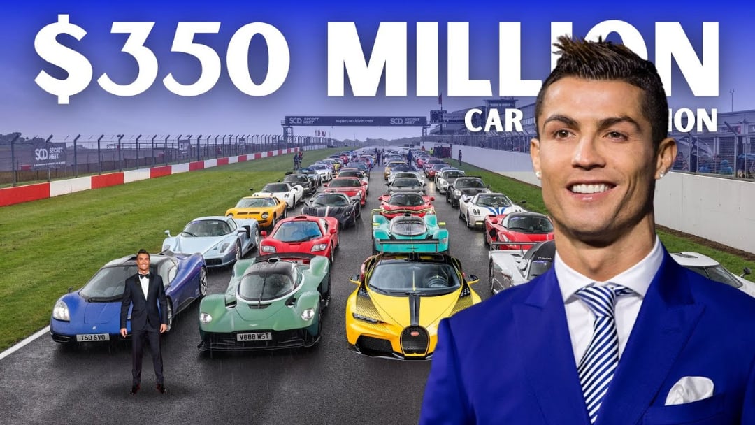 A man in a blue suit smiles in front of a large group of luxury sports cars on a racetrack. Text above reads "$350 million car collection.