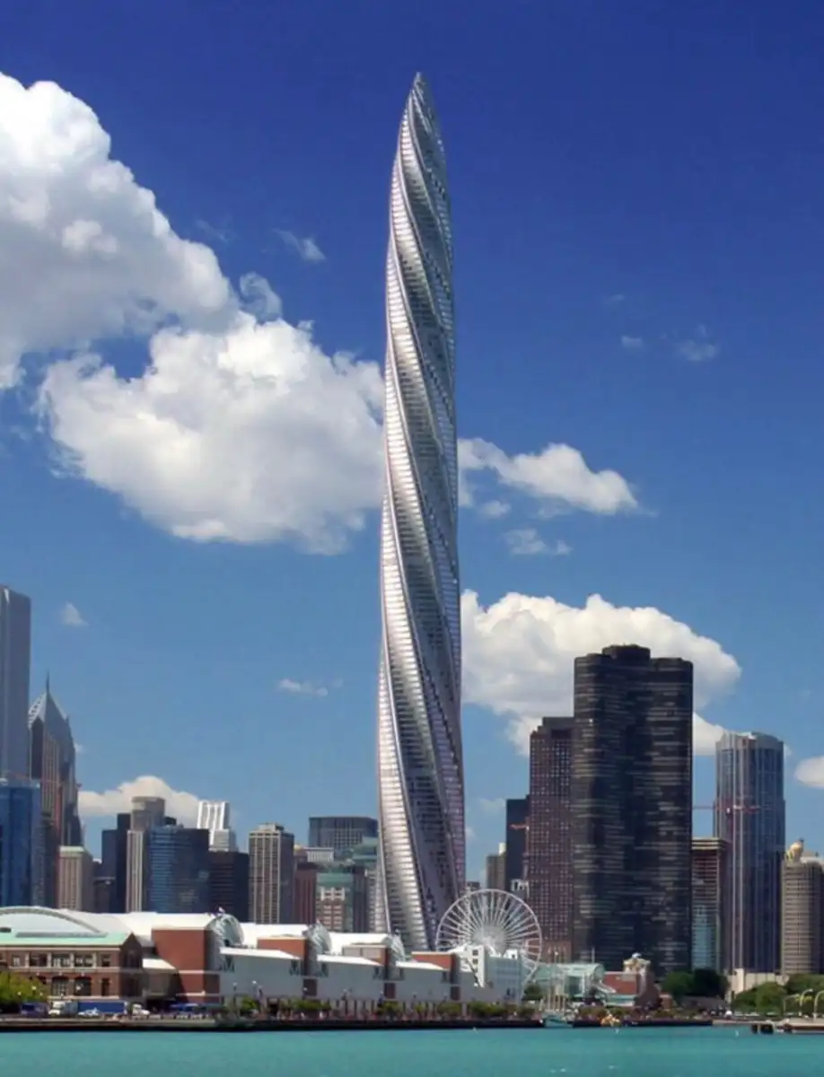 A tall, twisting skyscraper dominates the city skyline, surrounded by other buildings, a Ferris wheel, and a partly cloudy blue sky above.