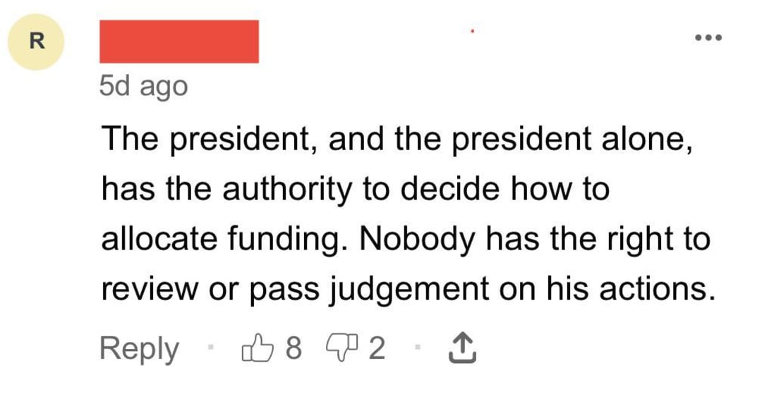 A social media comment claims only the president can decide on funding allocation and that no one can review or judge his actions. The comment has 8 likes, 2 dislikes, and a reply option. Username is hidden.
