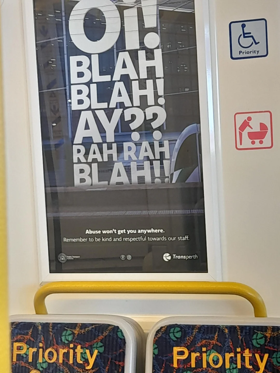 Poster on a public train with large text saying "Oi! BLAH! BLAH! AY?? RAH RAH BLAH!", and a message below that reads: "Abuse won't get you anywhere. Remember to be kind and respectful towards our staff.