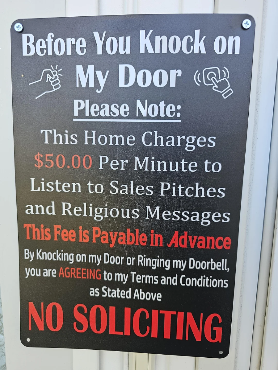 A sign reads: "Before You Knock on My Door Please Note: This home charges $50.00 per minute to listen to sales pitches and religious messages. Fee payable in advance. NO SOLICITING" in bold text.
