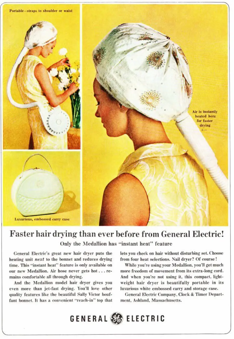 A woman sits with a towel on her head, using a portable General Electric Medallion hair dryer. An inset shows a close-up of her under the dryer cap. The ad highlights the product's features and luxury case.