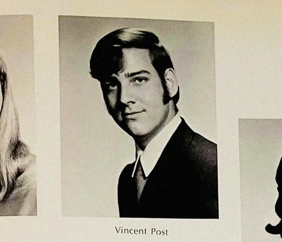 A black-and-white yearbook photo of a young man with dark hair styled to the side, wearing a suit and tie, and smiling slightly. The name "Vincent Post" is printed below the image.