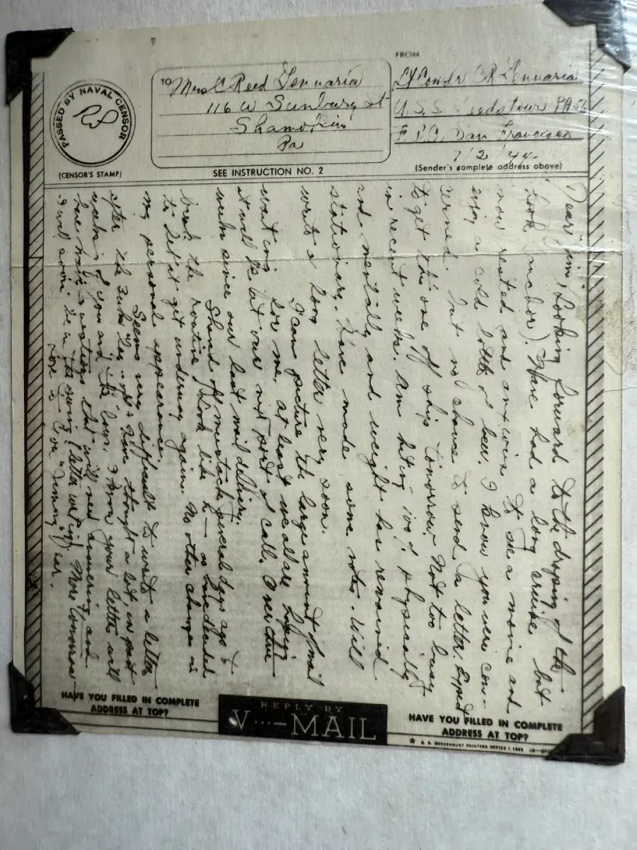 Black-and-white photo of a handwritten V-Mail letter with text filling the page diagonally. The sender and receiver's addresses are visible at the top, and an official stamp is in the upper left corner. The letter is aged and slightly worn.