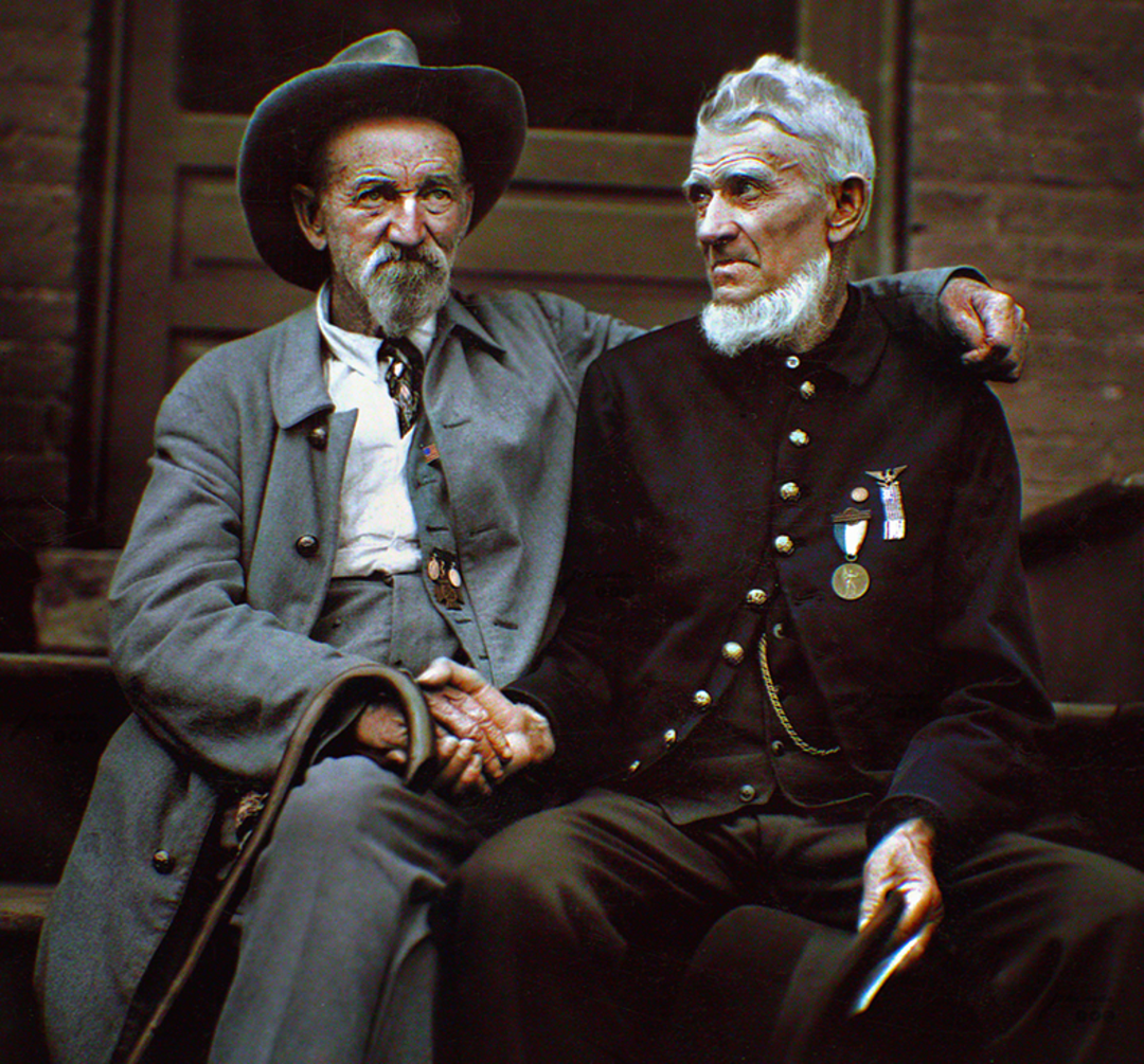 Two elderly men sit together on steps, shaking hands. One wears a wide-brimmed hat and gray coat; the other wears a dark uniform with medals. They look at each other warmly, suggesting camaraderie and reconciliation.
