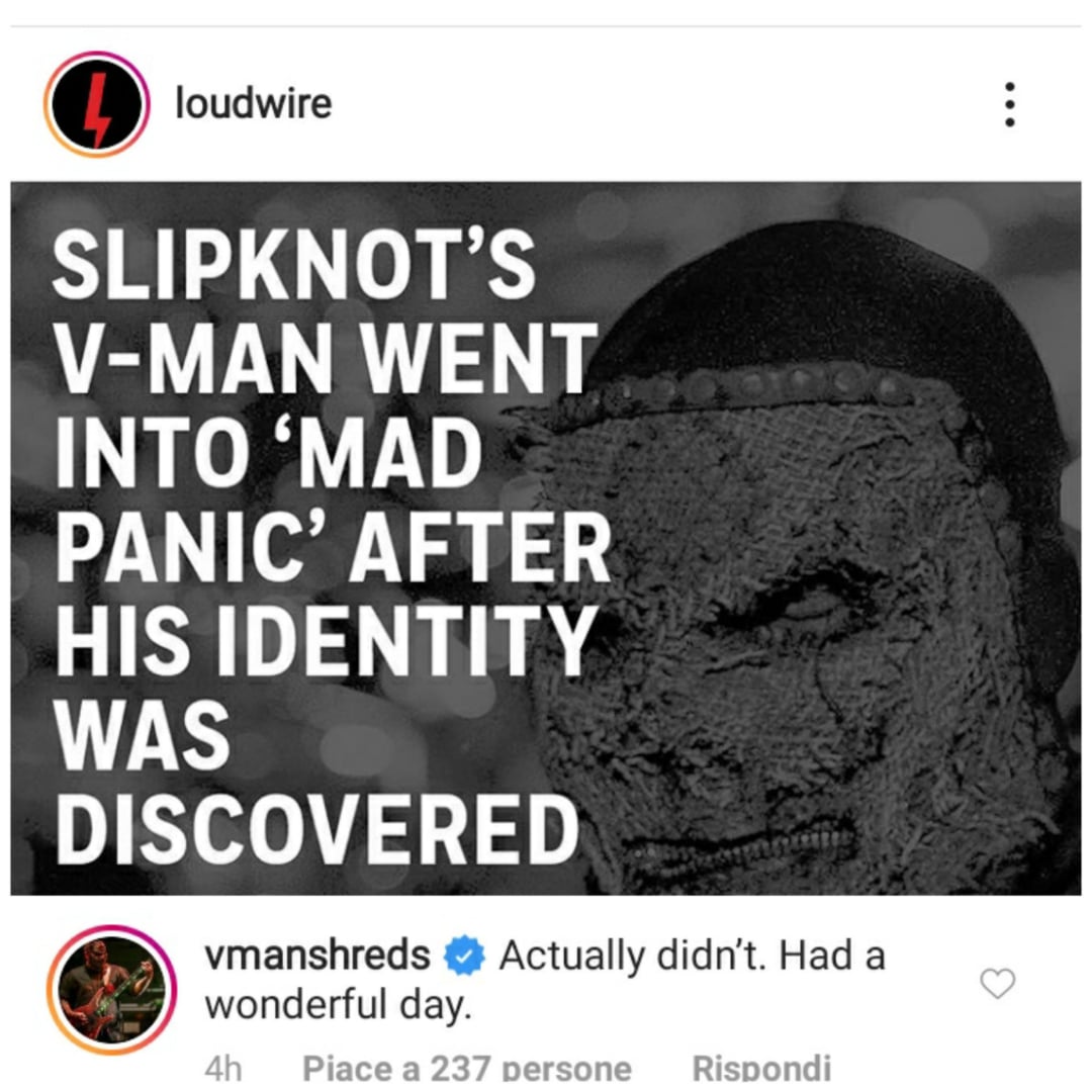 Instagram post by Loudwire with text: “Slipknot’s V-Man went into ‘mad panic’ after his identity was discovered.” Background shows a masked figure. Below, a comment from vmanhsreds says, “Actually didn’t. Had a wonderful day.”