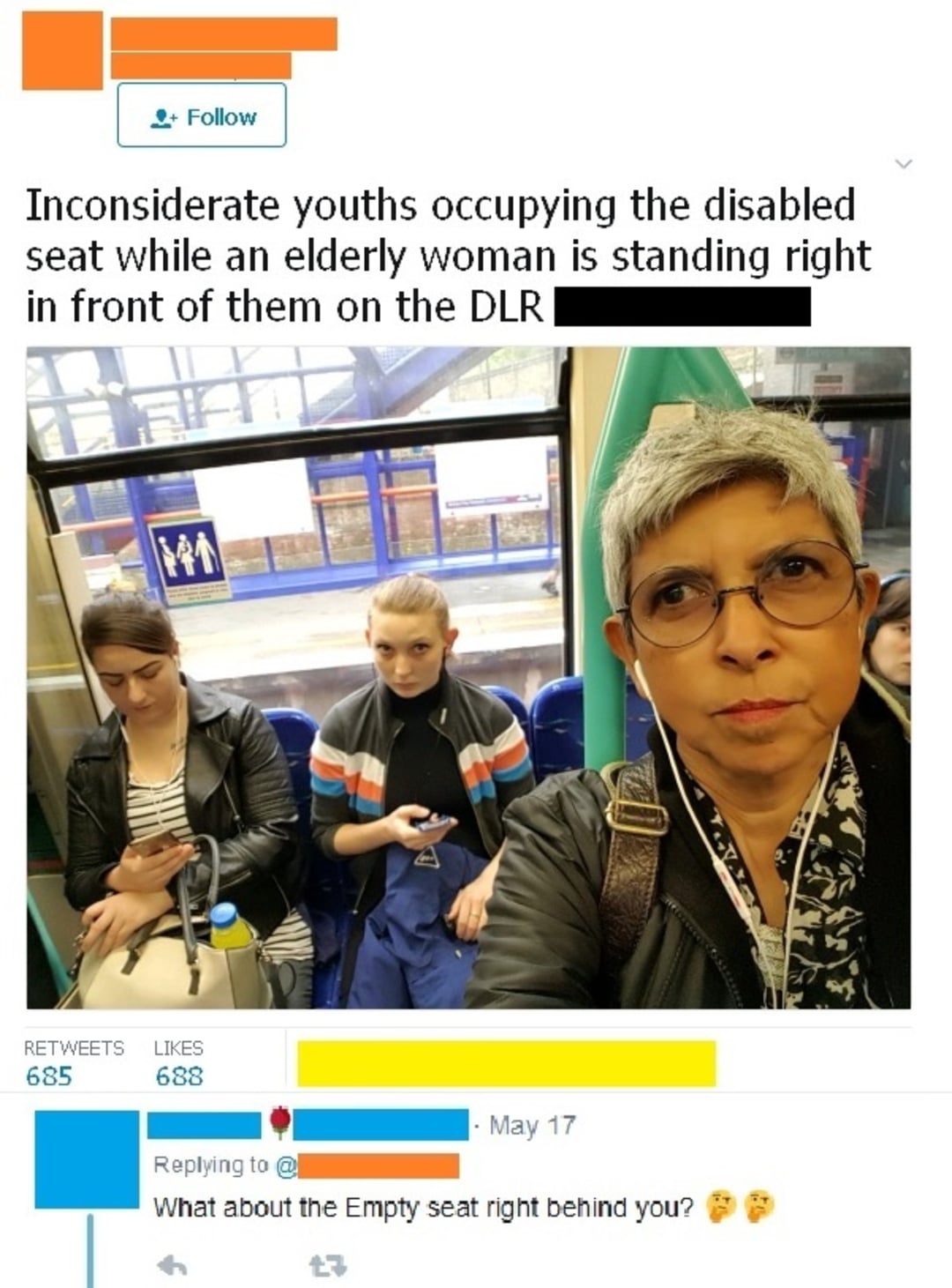 A woman takes a selfie on a train, looking displeased. Two young people sit in seats labeled for the disabled, using their phones. The tweet above accuses them of being inconsiderate, while an empty seat is visible behind her.