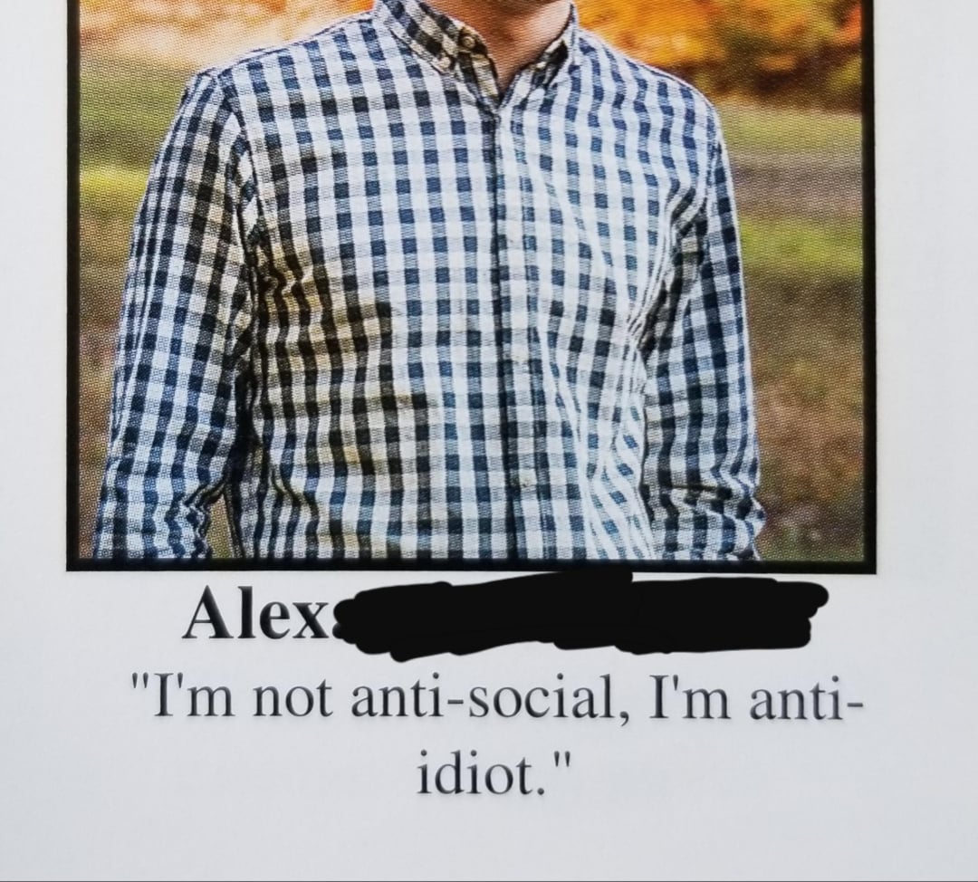 A person wearing a black and white checkered shirt stands outdoors. Below the image, the name "Alex" is partially blacked out, followed by the quote: "I'm not anti-social, I'm anti-idiot.