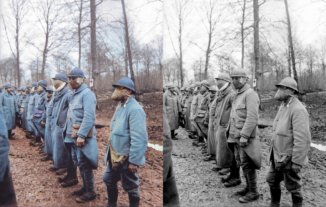 A line of WWI soldiers wearing blue uniforms and protective masks stands outdoors in a muddy, leafless forest; the left side of the image is colorized, and the right side is black and white.
