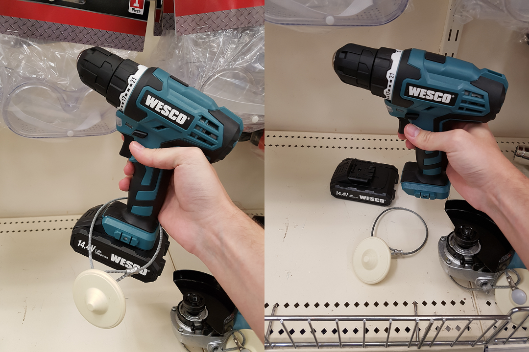 A hand holds a blue and black WESCO cordless drill in a store; on the left, a battery is attached, and on the right, the battery is removed and placed on the shelf next to the drill and metal parts.