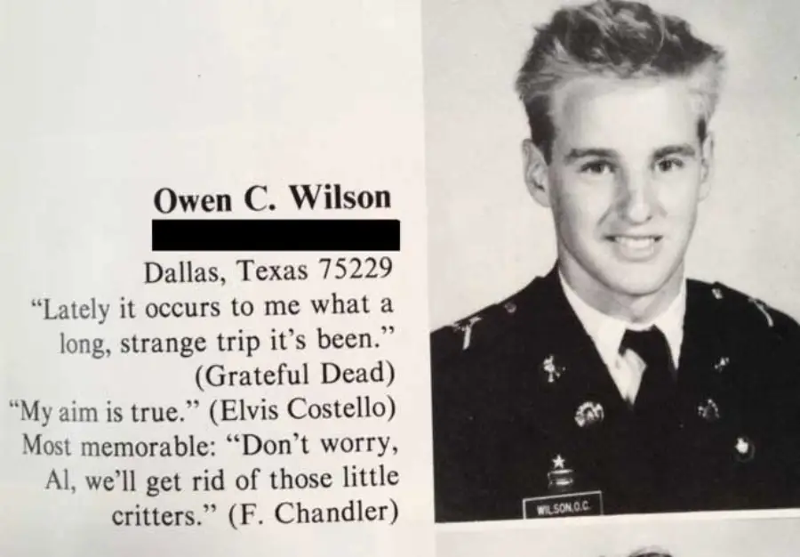 Black and white yearbook photo of a young man in a military-style uniform. Text beside him lists his name, Owen C. Wilson, hometown Dallas, quotes from the Grateful Dead, Elvis Costello, and a memorable saying.