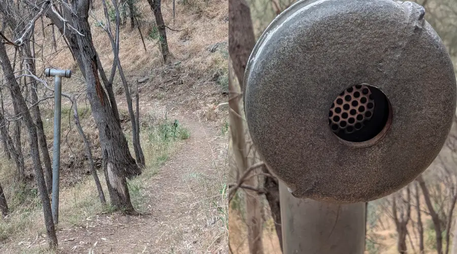 A metal listening tube stands beside a dirt trail in a dry, wooded area. A close-up shows the tube’s circular opening, which is covered by a mesh inside.