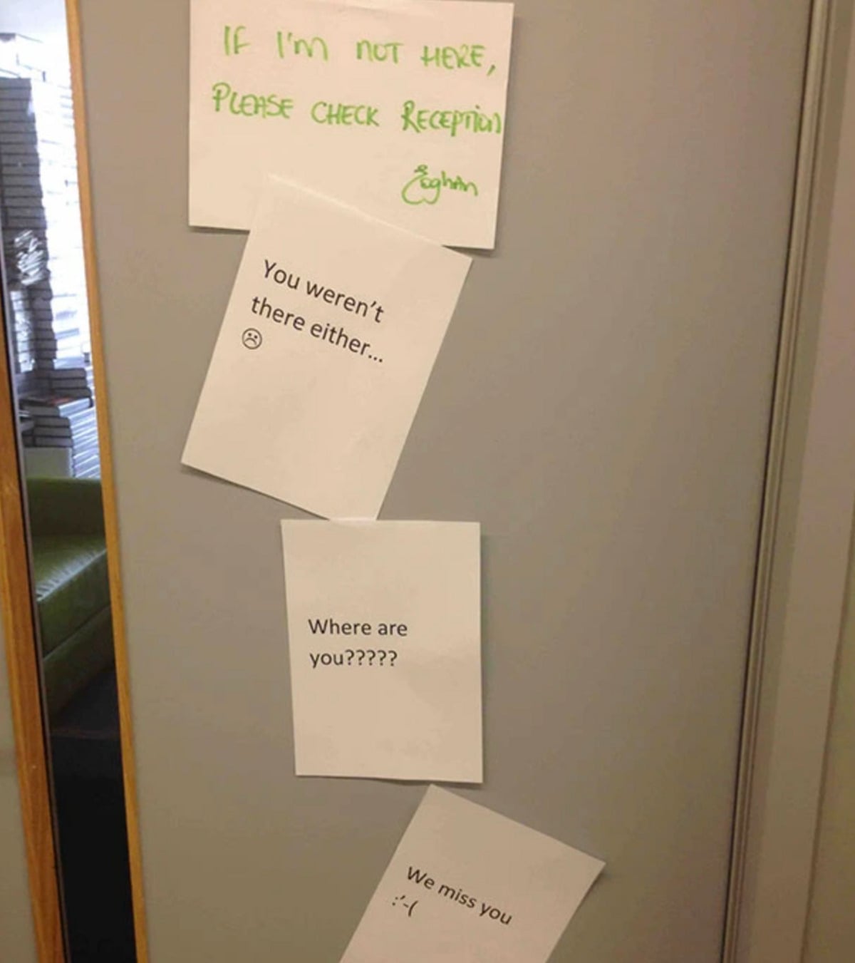 Four handwritten and printed notes on a door: “If I’m not here, please check reception (Eughan)”, “You weren’t there either…”, “Where are you?????”, and “We miss you :( ”