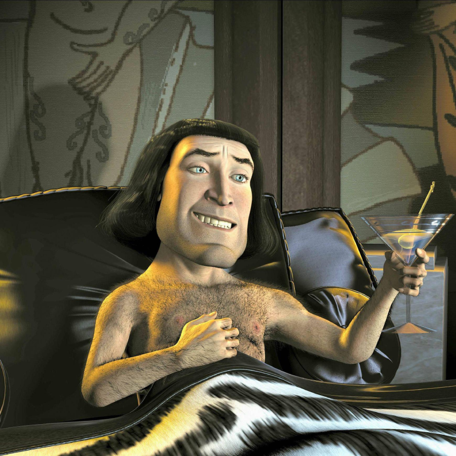 A computer-animated character with short black hair relaxes on a couch, covered by a blanket, holding a martini glass and smiling. The setting appears to be luxurious, with patterned pillows and background art.