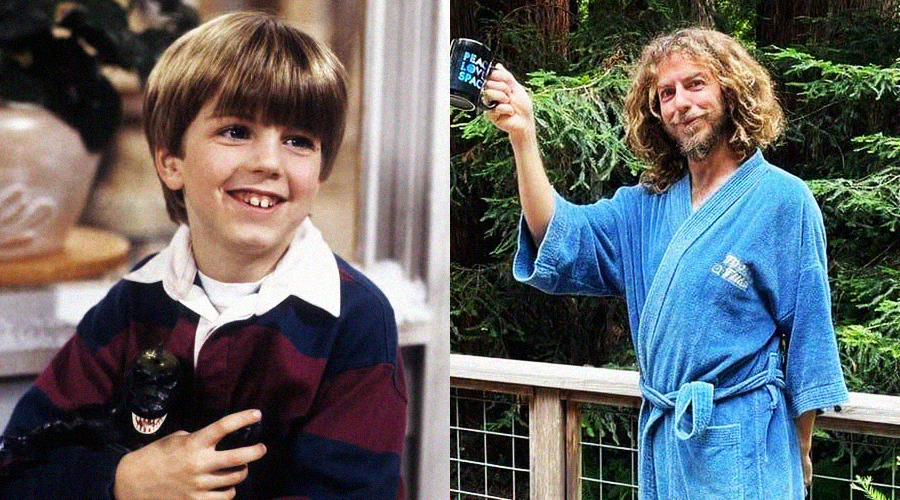 Split image: On the left, a young boy with light brown hair smiles while holding a black toy figure. On the right, the same person as an adult stands outdoors in a blue robe, raising a mug and smiling, with trees in the background.