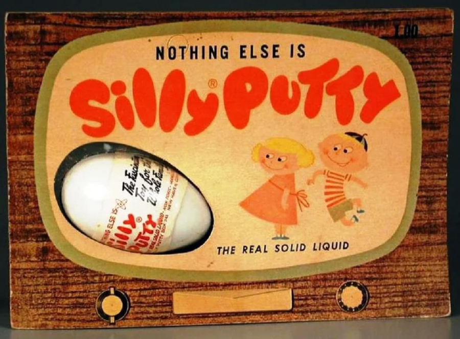 Vintage Silly Putty packaging shaped like a TV, with a plastic egg containing putty and cartoon children. Text reads “NOTHING ELSE IS Silly Putty THE REAL SOLID LIQUID.”