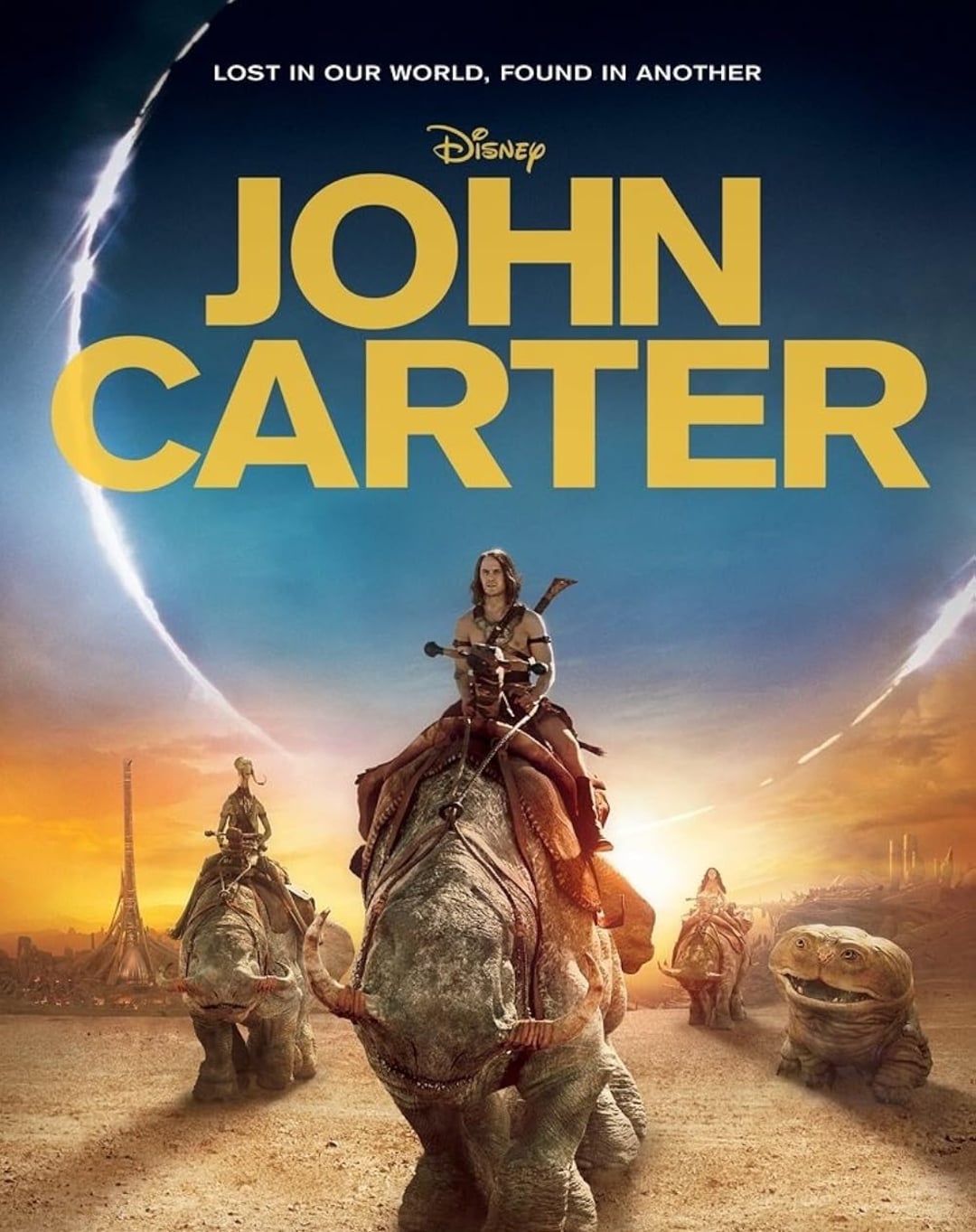 Movie poster for "John Carter," showing a man riding a large alien creature across a desert landscape with futuristic buildings and two moons in the sky. Text reads: "Lost in our world, found in another.