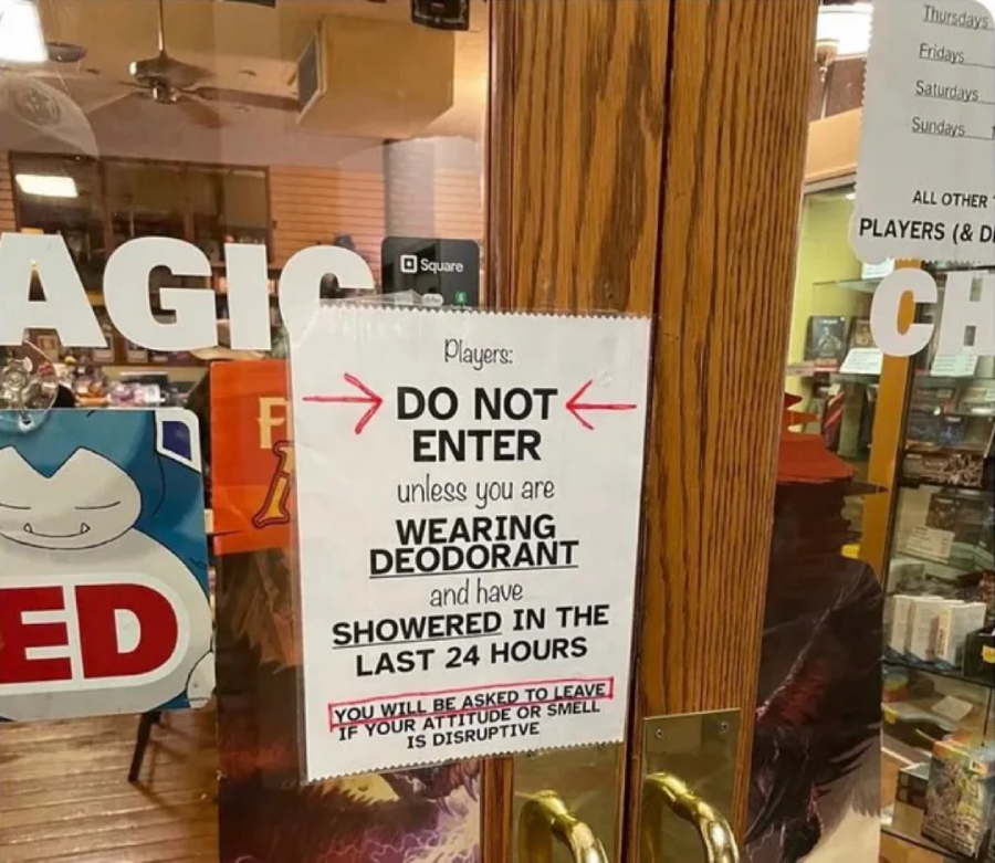 A sign on a glass door reads: "Players: DO NOT enter unless you are WEARING DEODORANT and have SHOWERED IN THE LAST 24 HOURS. YOU WILL BE ASKED TO LEAVE IF YOUR ATTITUDE OR SMELL IS DISRUPTIVE.