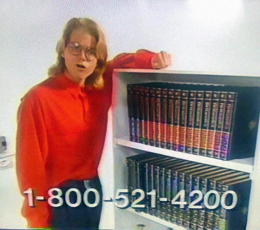 A person in a red shirt stands next to a white bookshelf filled with encyclopedias, with a phone number, 1-800-521-4200, displayed across the bottom of the image.