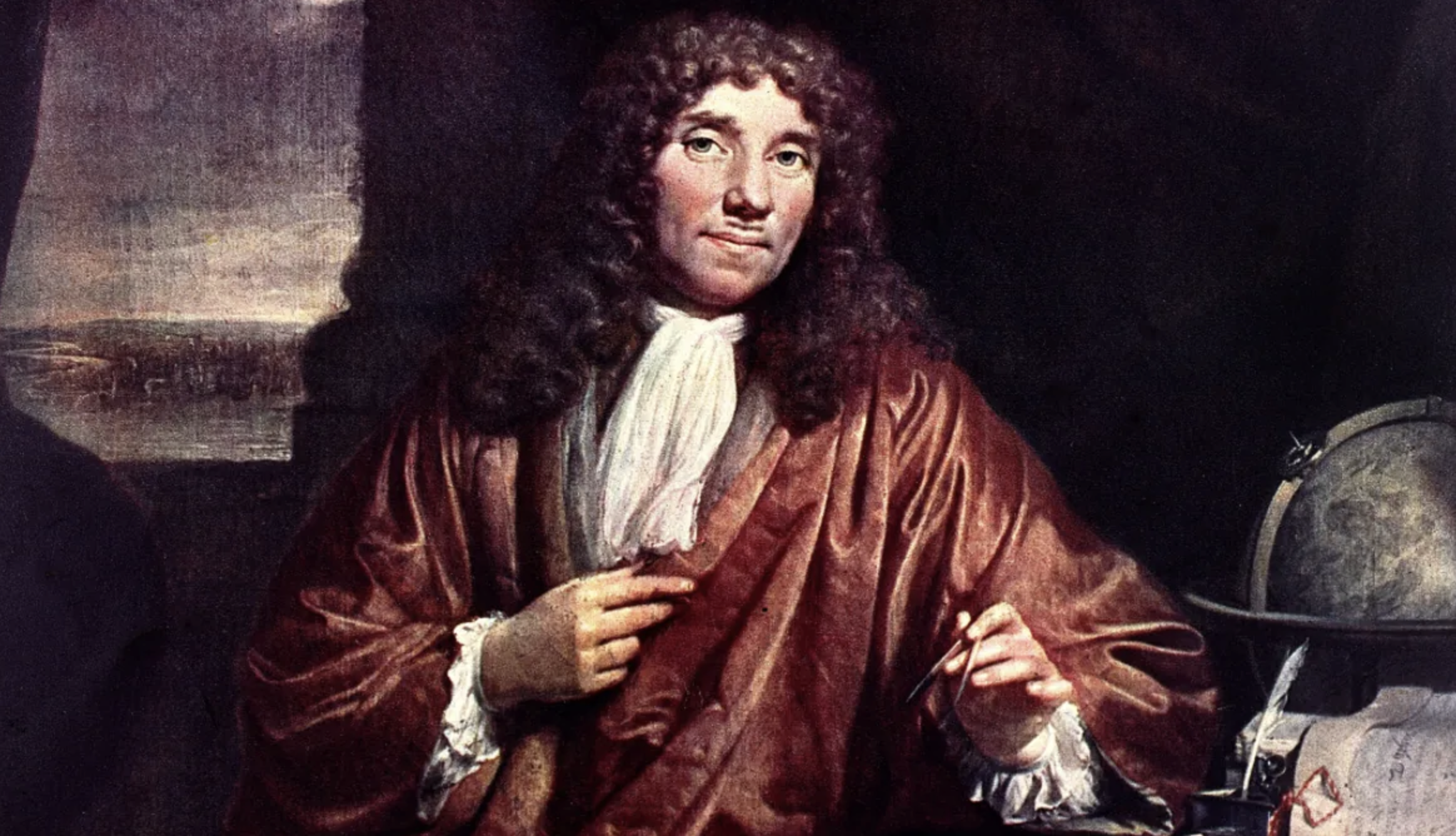 A man with long curly hair wearing a brown robe and white cravat sits holding a quill pen. A globe and scientific instruments are on the table beside him. The background is dark and shadowy.
