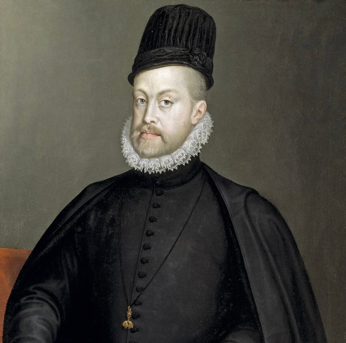 A man in dark, formal Renaissance clothing with a tall black hat, white ruffled collar, and a short beard poses against a plain background. He wears a cloak and has a composed expression.
