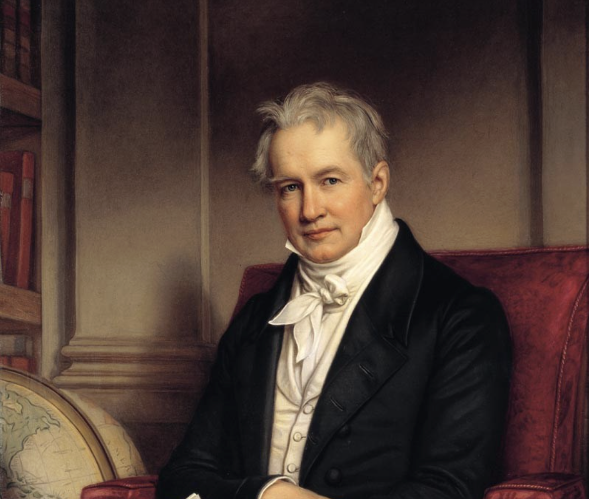 A distinguished man with gray hair sits in a red armchair, wearing a black coat, white shirt, and cravat. Bookshelves and a globe are visible in the background, suggesting a scholarly setting.