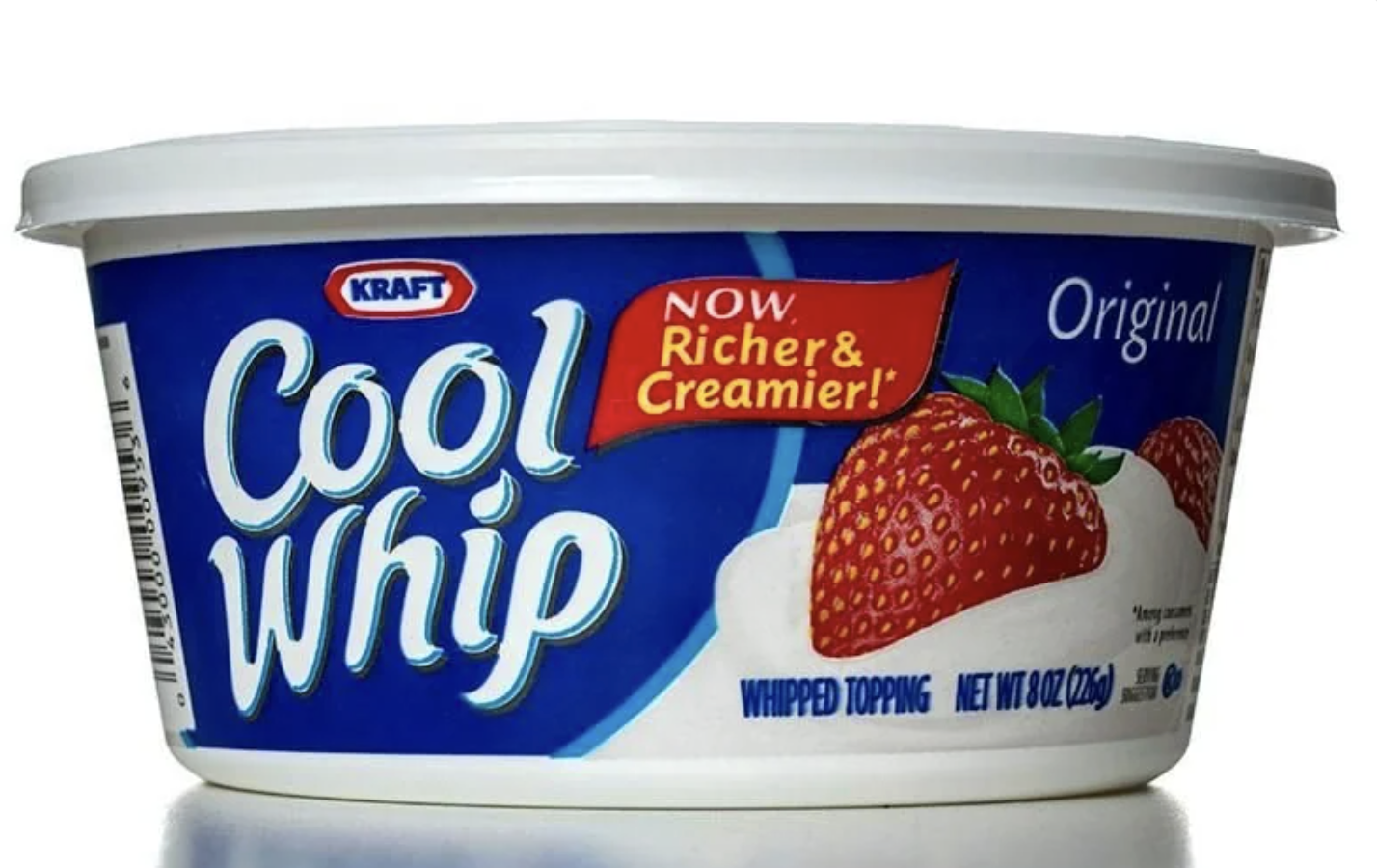 A tub of Kraft Cool Whip Original whipped topping with a label showing strawberries on whipped cream and text reading "Now, Richer & Creamier!" on the blue and white packaging.