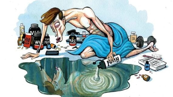 A thin, gaunt man draped in a blue towel kneels beside a puddle, pouring protein powder into it. Surrounding him are supplements, pills, a dumbbell, and fitness books, reflecting an obsession with bodybuilding.