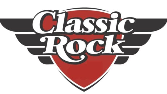 Logo with the words "Classic Rock" in bold white letters, outlined in black, over a red shield. Black stylized wings extend from both sides of the shield. The background is white.