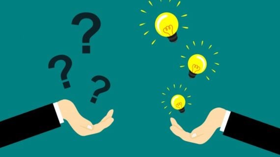 Two hands facing upward; the left hand has three floating question marks, and the right hand has three floating glowing light bulbs, symbolizing ideas or solutions. The background is teal.