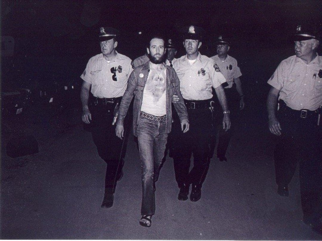 George Carlin being arrested for performing an inappropriate routine in 1972.
