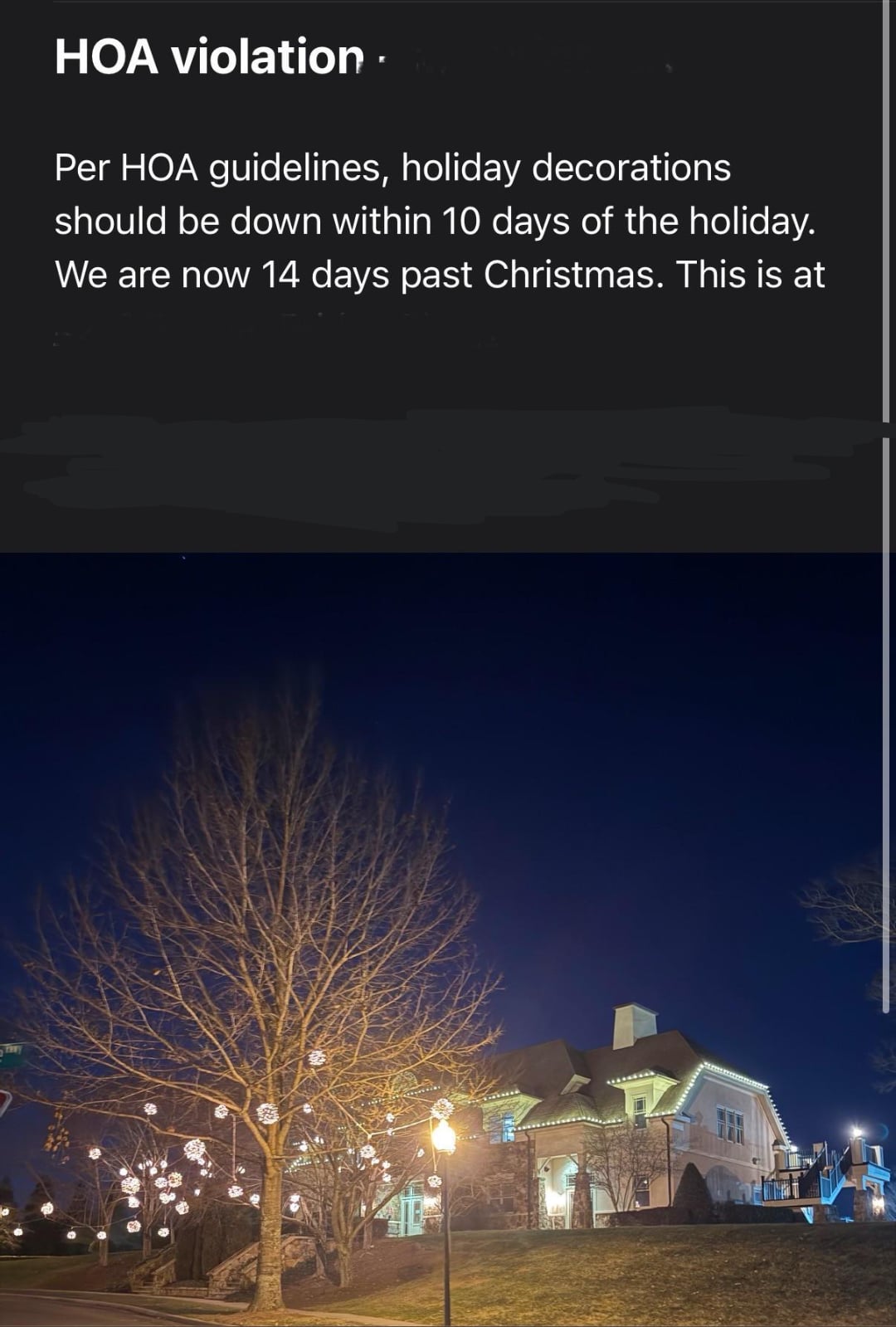 A house decorated with Christmas lights at night, with illuminated trees and bushes in the yard. Text above states an HOA violation for keeping holiday decorations up 14 days after Christmas.